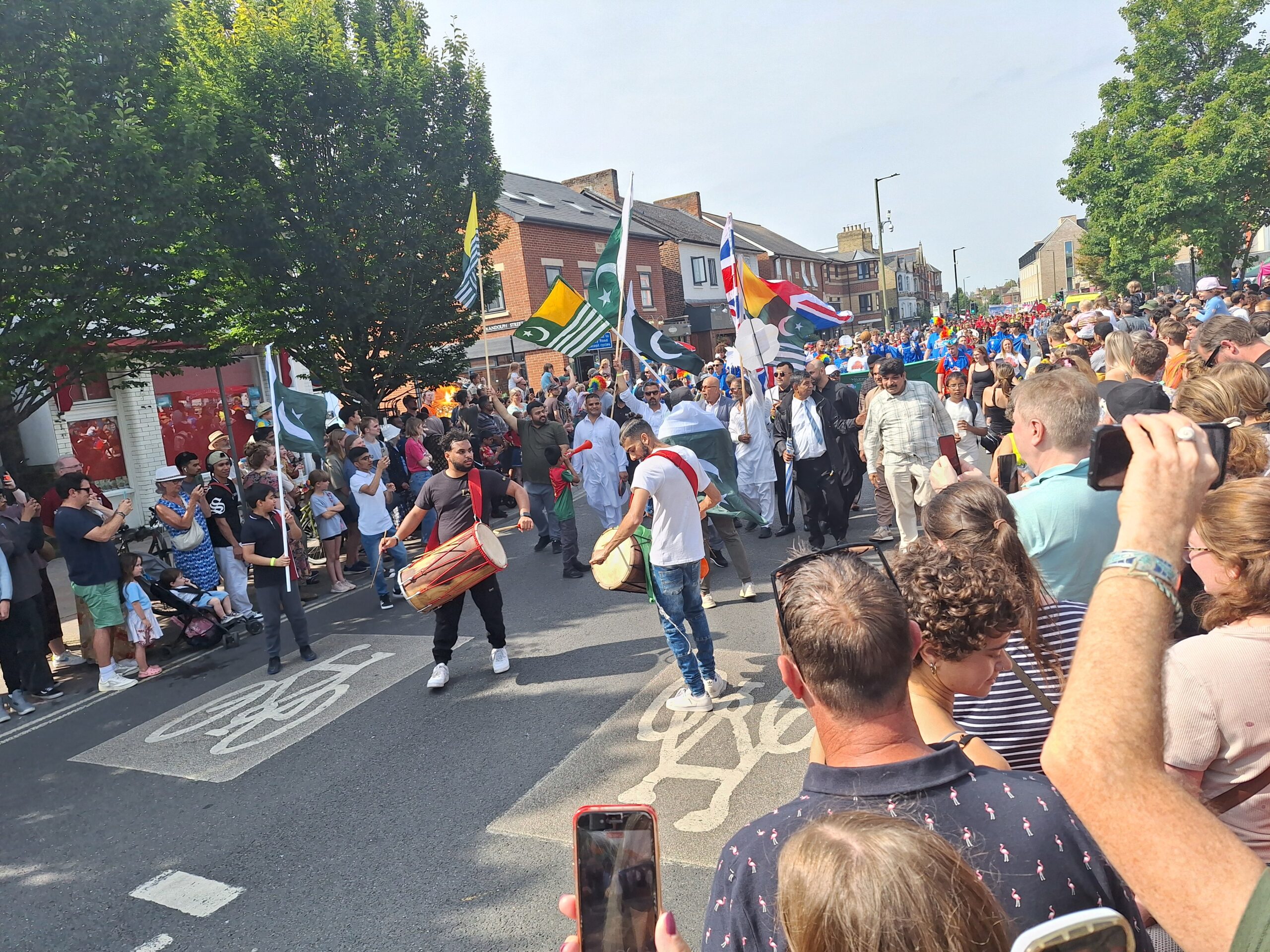 Parade on the street with multicultural flags