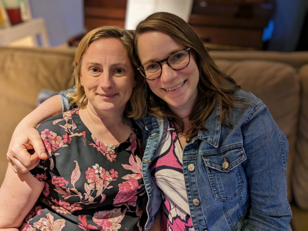 Two happy faces looking towards the camera