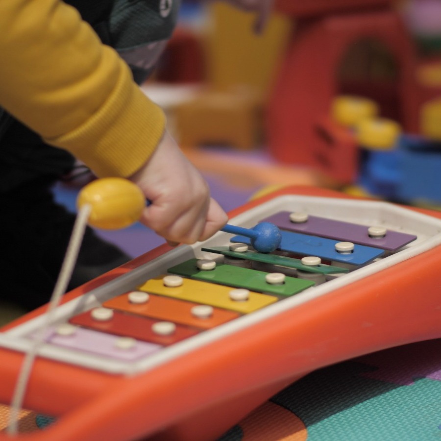Child playing a xylophone