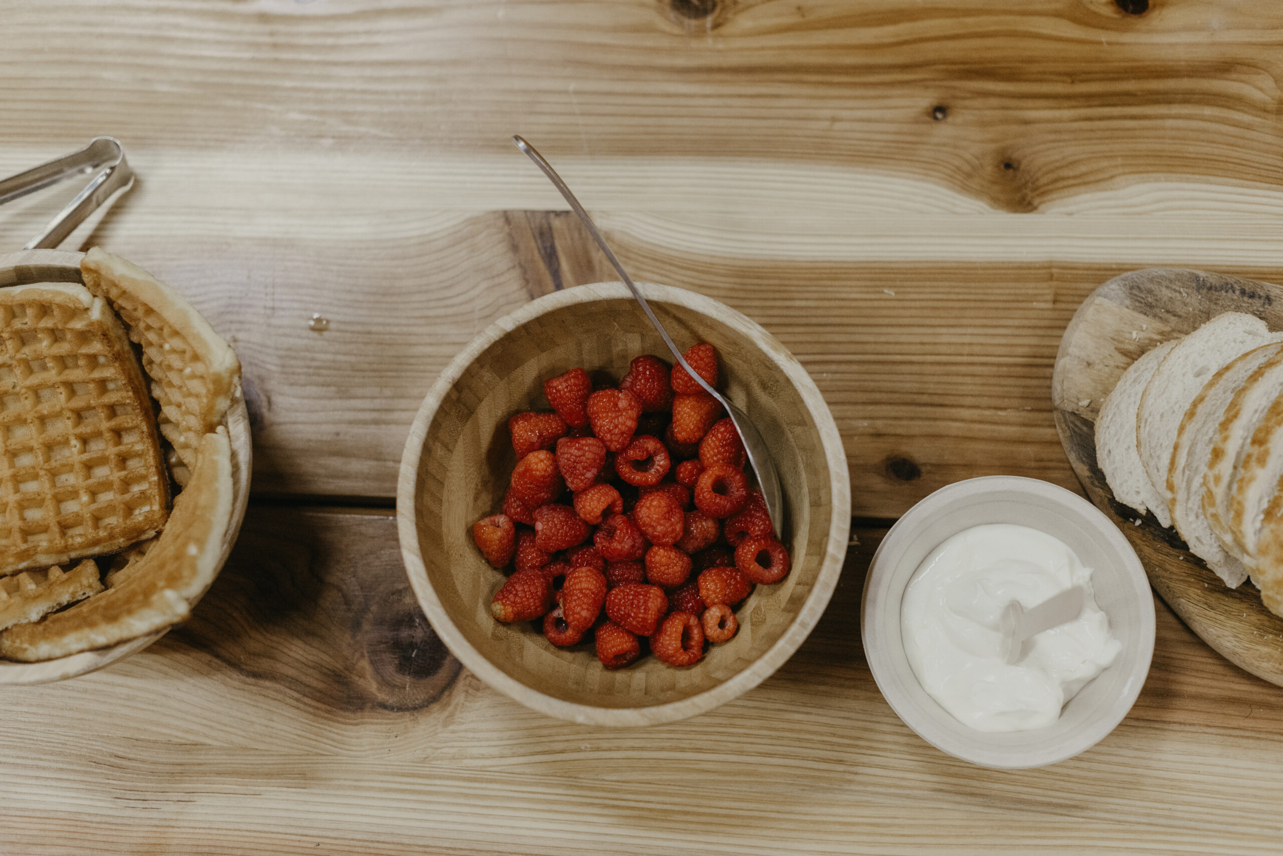 Raspberries in a bowl on a table